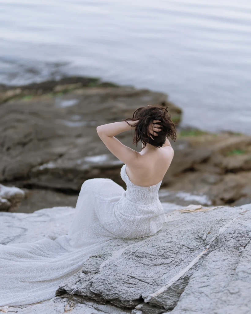 Bride Anastasia in her wedding dress during a seaside couple session in Kavala