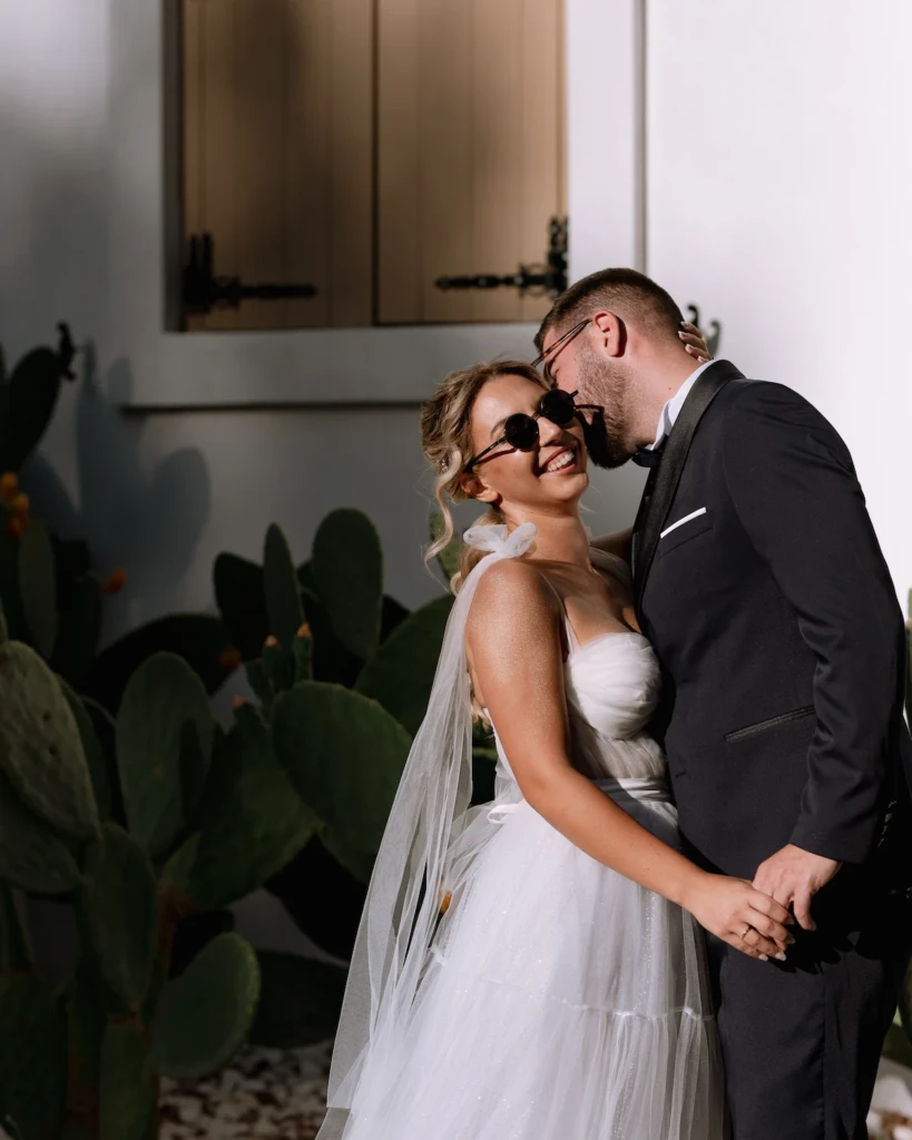 Bride Fenia in her tulle wedding dress during a seaside couple session