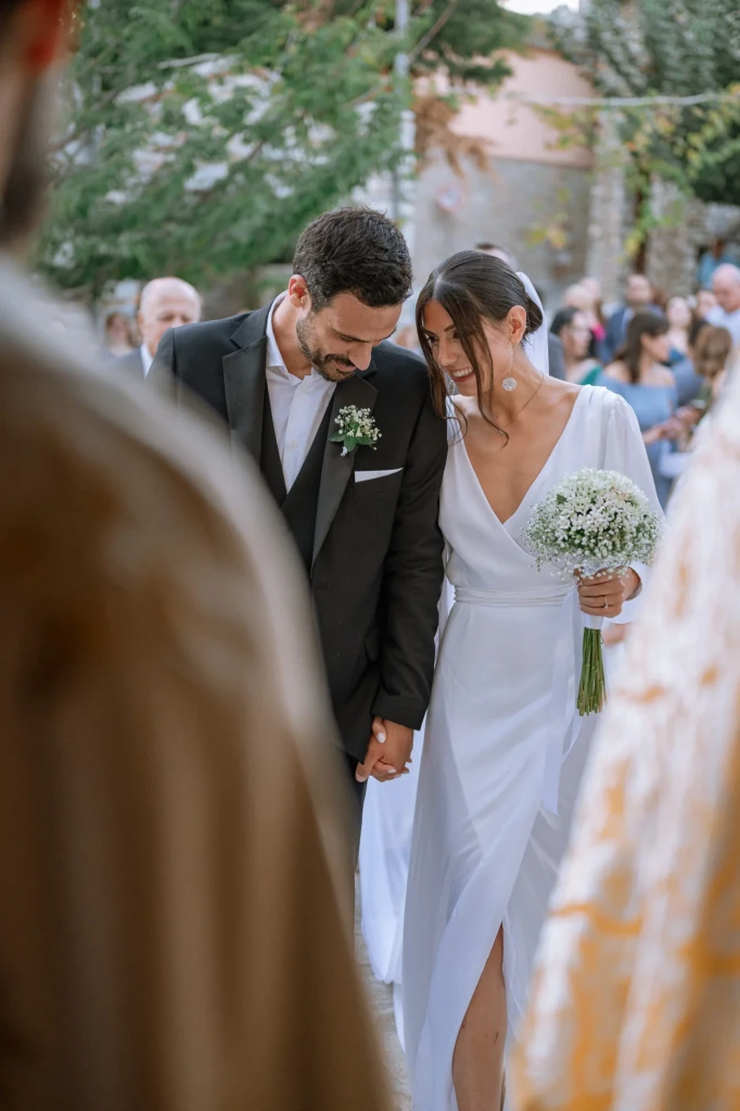 Hara and Giannis during their wedding ceremony at Psiliammos, Thassos