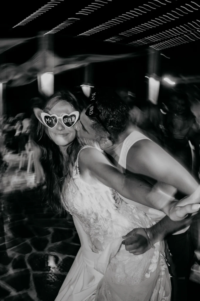Maria and Giannis celebrating at their wedding reception in Skala Prinos, Thassos